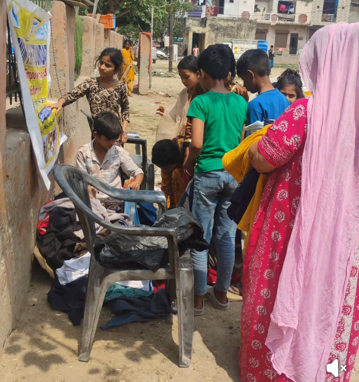 Children receiving donated clothes